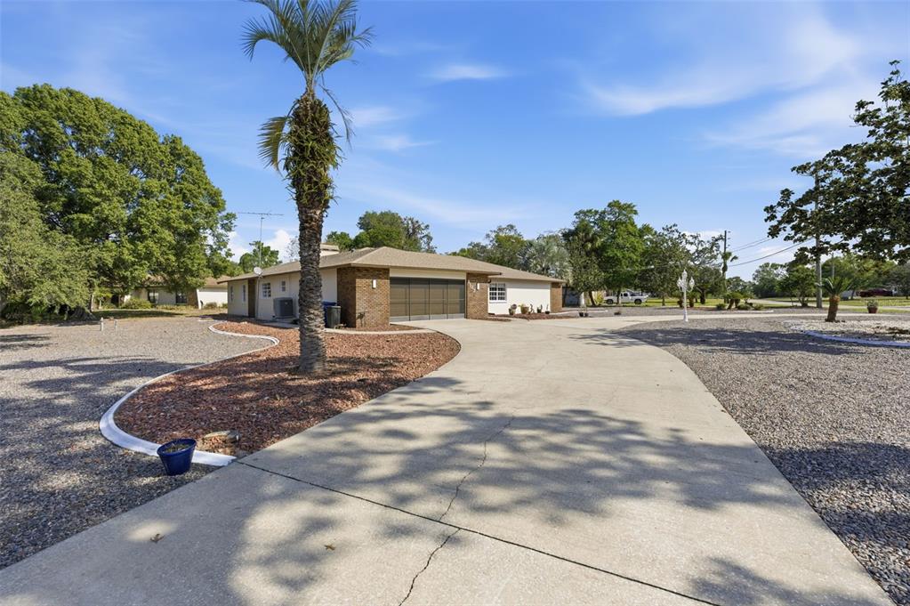 8123 River Country Drive Weeki Wachee, FL 34607 - Photo 10 of 61 a view of a house with a yard
