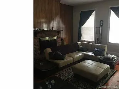 a living room with furniture and window