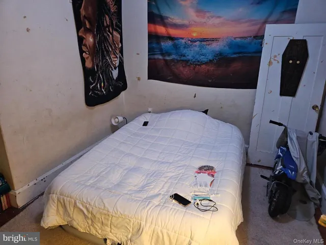 a bedroom with a bed and a couch