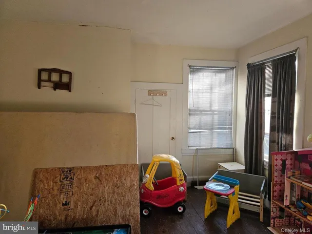 a room with furniture and gym equipment