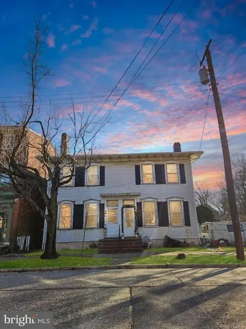 a brick building with a clock on the side of it