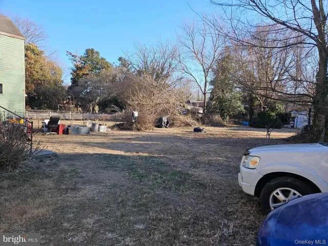 a view of street with parked cars