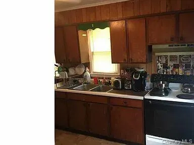 a kitchen with a sink and cabinets