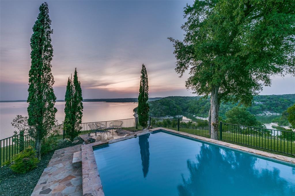 1237 Overlook Court Whitney, TX 76692 - Photo 1 of 39 a view of a swimming pool with a patio