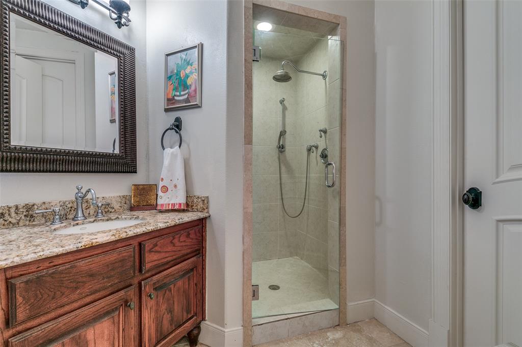 1237 Overlook Court Whitney, TX 76692 - Photo 14 of 39 a bathroom with a shower sink and mirror