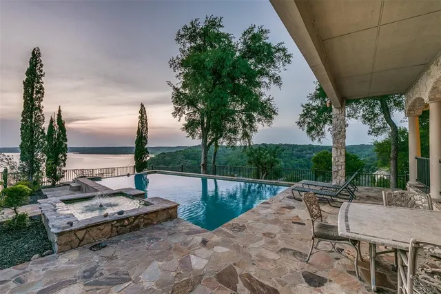 a view of swimming pool with a patio