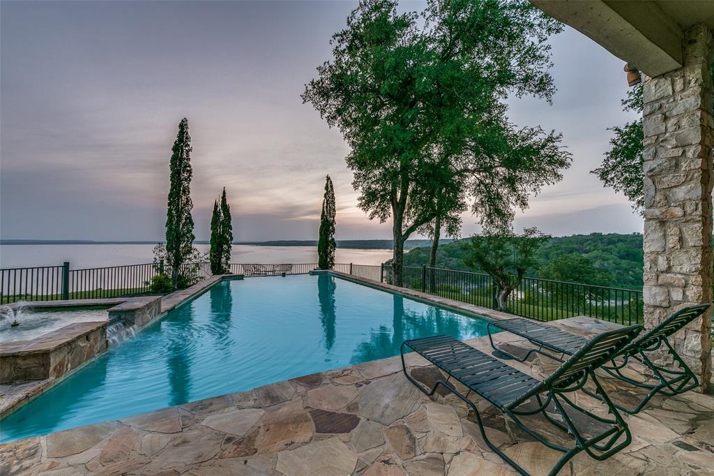 1237 Overlook Court Whitney, TX 76692 - Photo 19 of 39 a view of a balcony with two chairs and a table