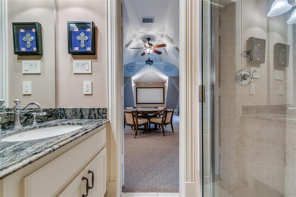 1237 Overlook Court Whitney, TX 76692 - Photo 39 of 39 a en suite bathroom with a granite countertop sink and a mirror