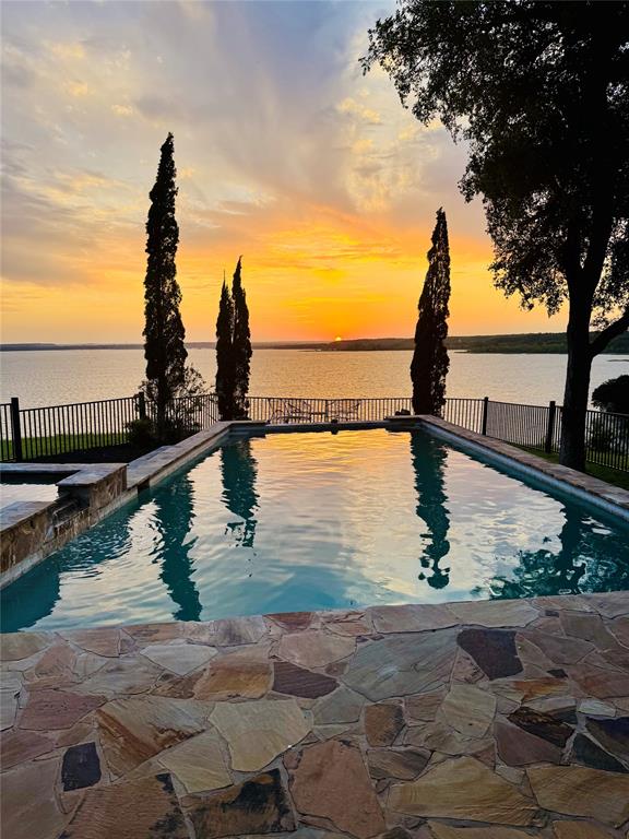 1237 Overlook Court Whitney, TX 76692 - Photo 9 of 39 a view of a lake with large trees