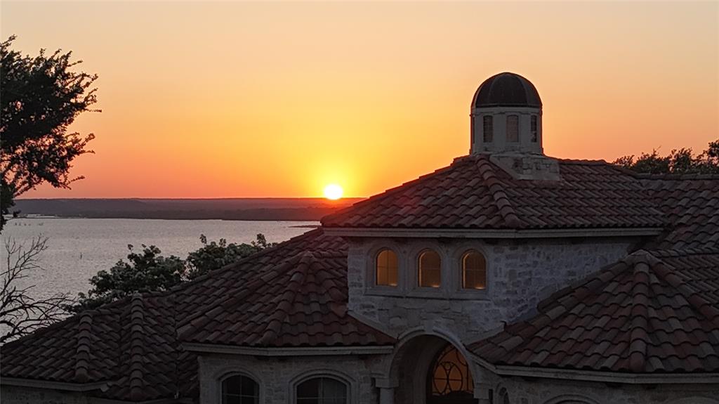 1237 Overlook Court Whitney, TX 76692 - Photo 10 of 39 a front view of a house with a garden