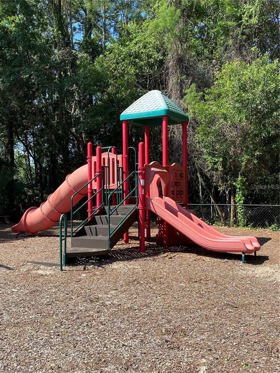 5132 Conroy Road, Unit 932 Orlando, FL 32811 - Photo 17 of 19 a view of outdoor space with lounge chairs