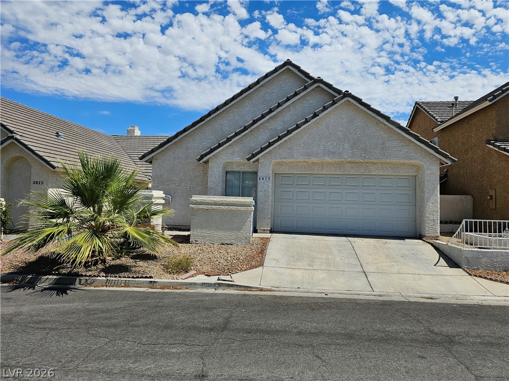 2817 Albemarle Way Henderson, NV 89014 - Photo 1 of 25 A well-maintained stucco home with an attached garage and desert-friendly landscaping.