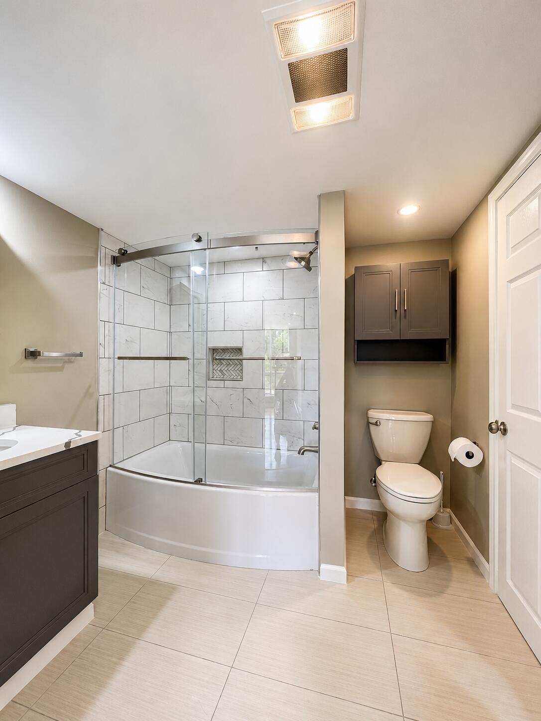 2612 Amsterdam Road Villa Hills, KY 41017 - Photo 34 of 52 BATHROOM 3 LOCATED IN THE BASEMENT FEATURING TWO VANITIES, TILE FLOORING, DEEP SOAKINGTUB/SHOWER AND STORAGE - LOCATED IN THE FINISHED BASEMENT