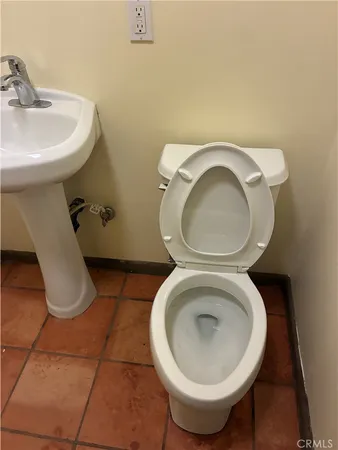 a close view of a sink and a toilet