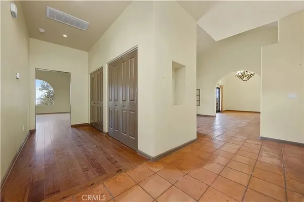 wooden floor in a hall with an entryway
