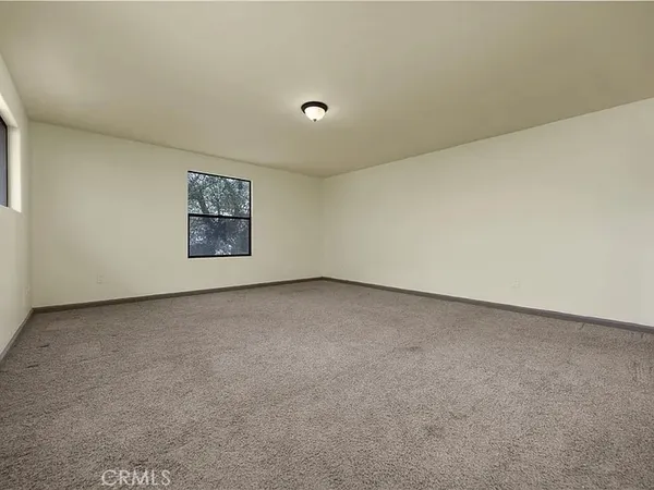 an empty room with a empty space and window