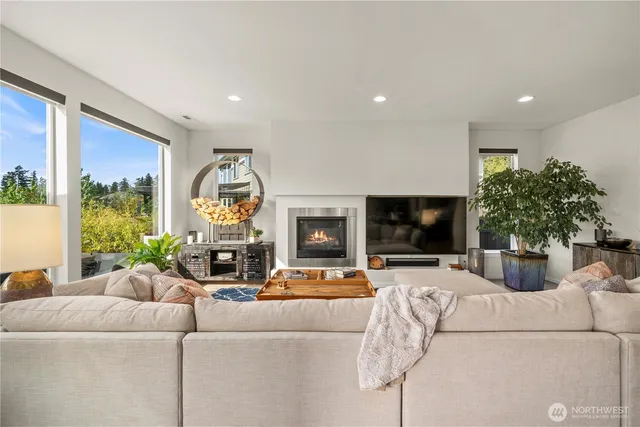 a living room with furniture fireplace and a flat screen tv