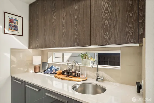 a kitchen with a sink and cabinets