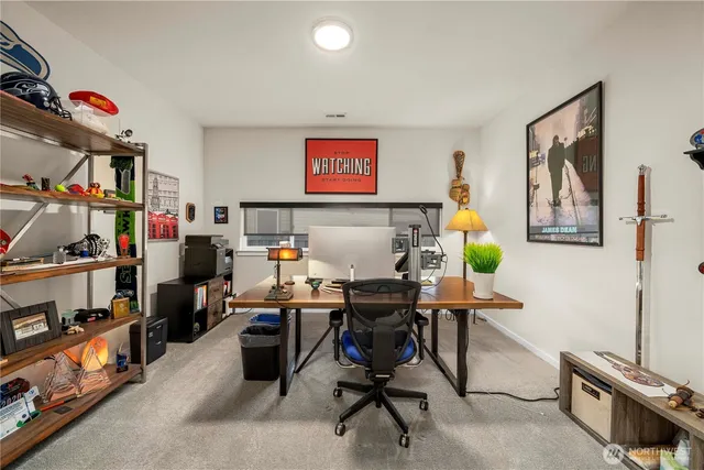 a bedroom with a bed and large mirror