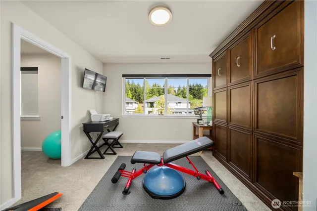 a bathroom with a sink a toilet and shower curtain