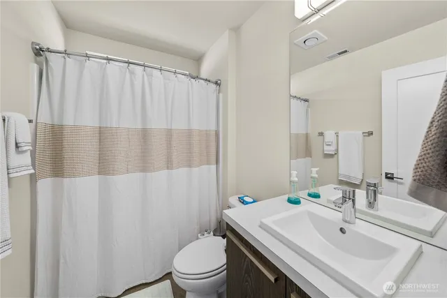 a bedroom with a bed and a table