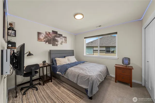 a view of storage and utility room with washer and dryer