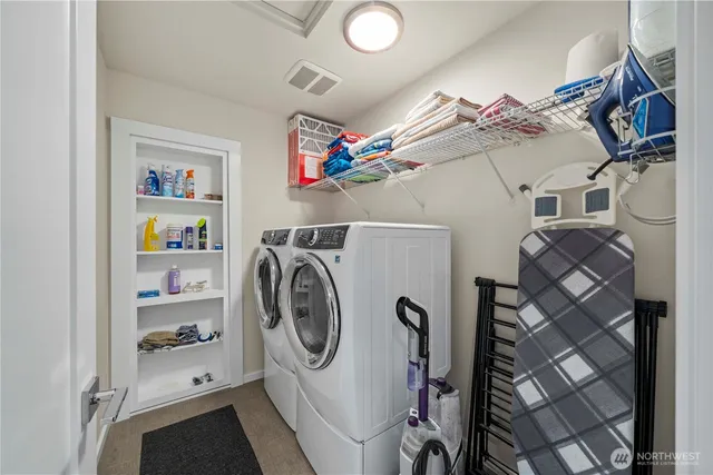 a view of a patio with table and chairs potted plants with wooden floor
