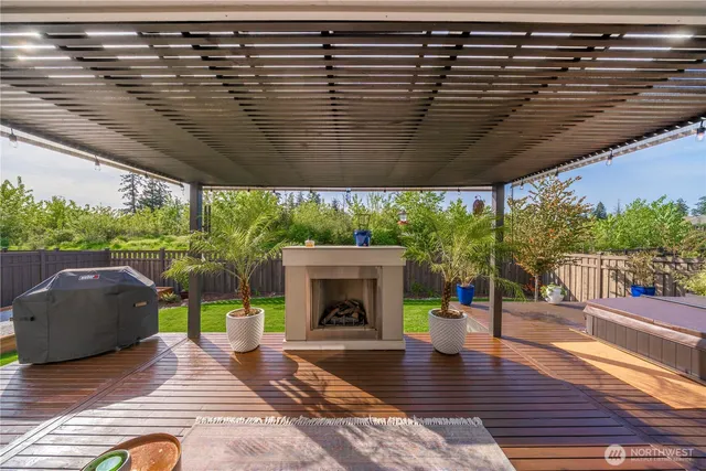 a view of a balcony with furniture and wooden floor