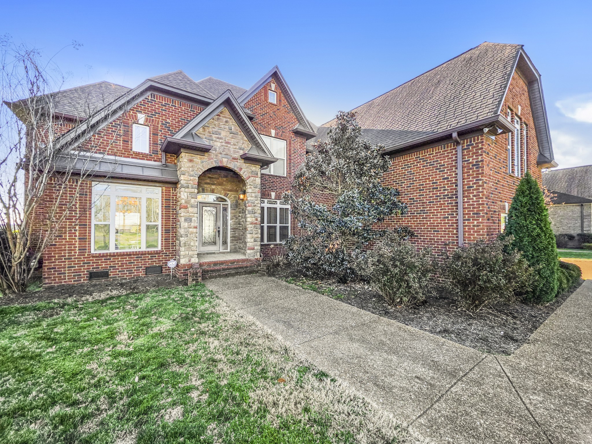 a front view of a house with garden