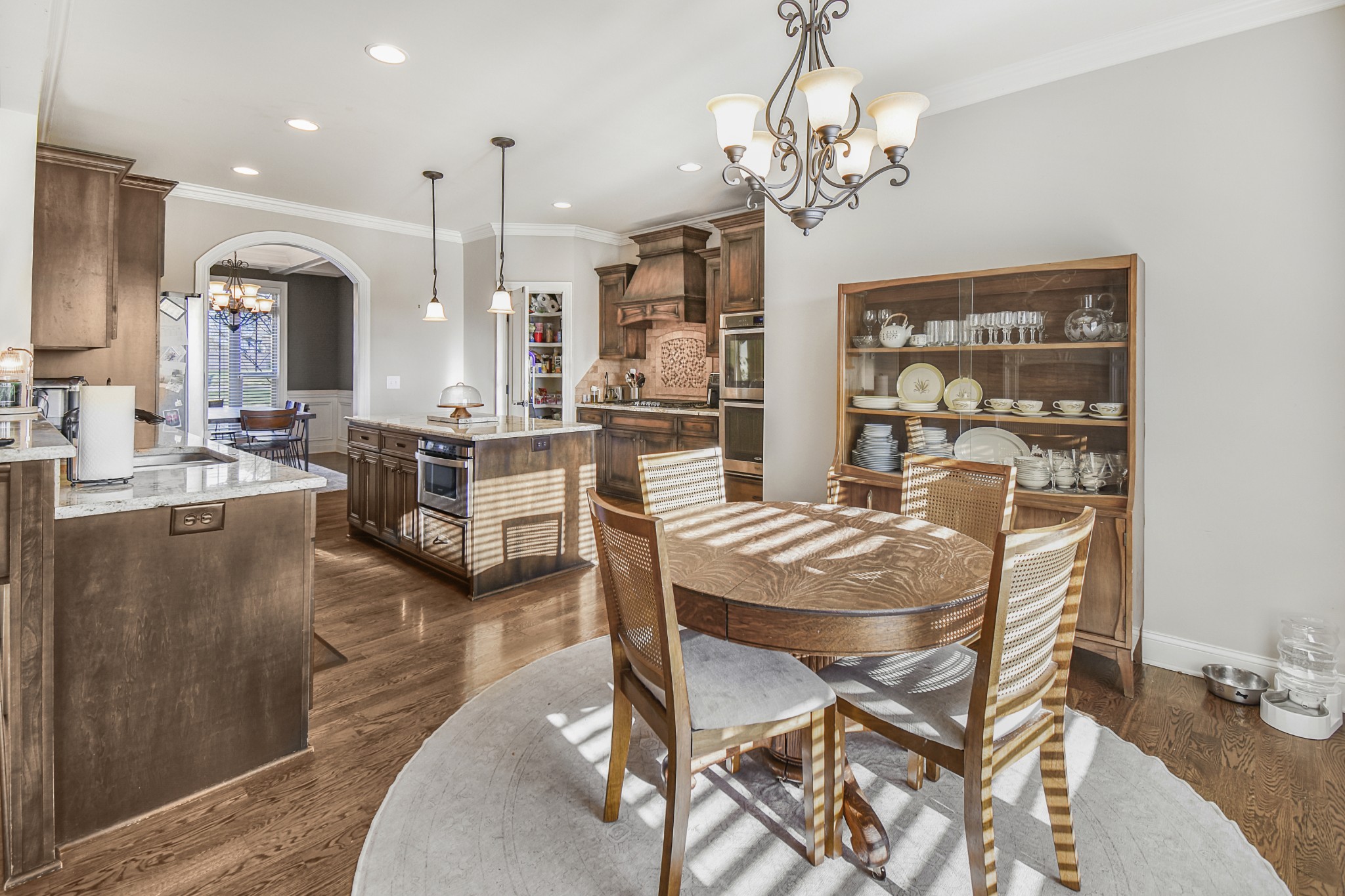 1133 Mires Road Mount Juliet, TN 37122 - Photo 12 of 51 a dining room with furniture a chandelier and kitchen view