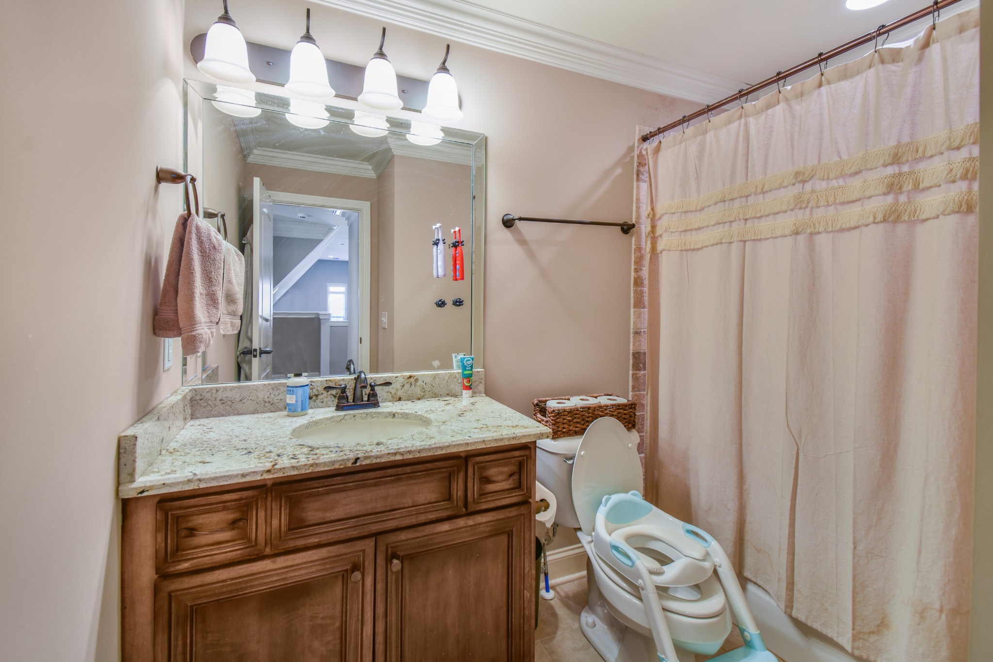 1133 Mires Road Mount Juliet, TN 37122 - Photo 25 of 51 a bathroom with a granite countertop sink vanity mirror and a toilet