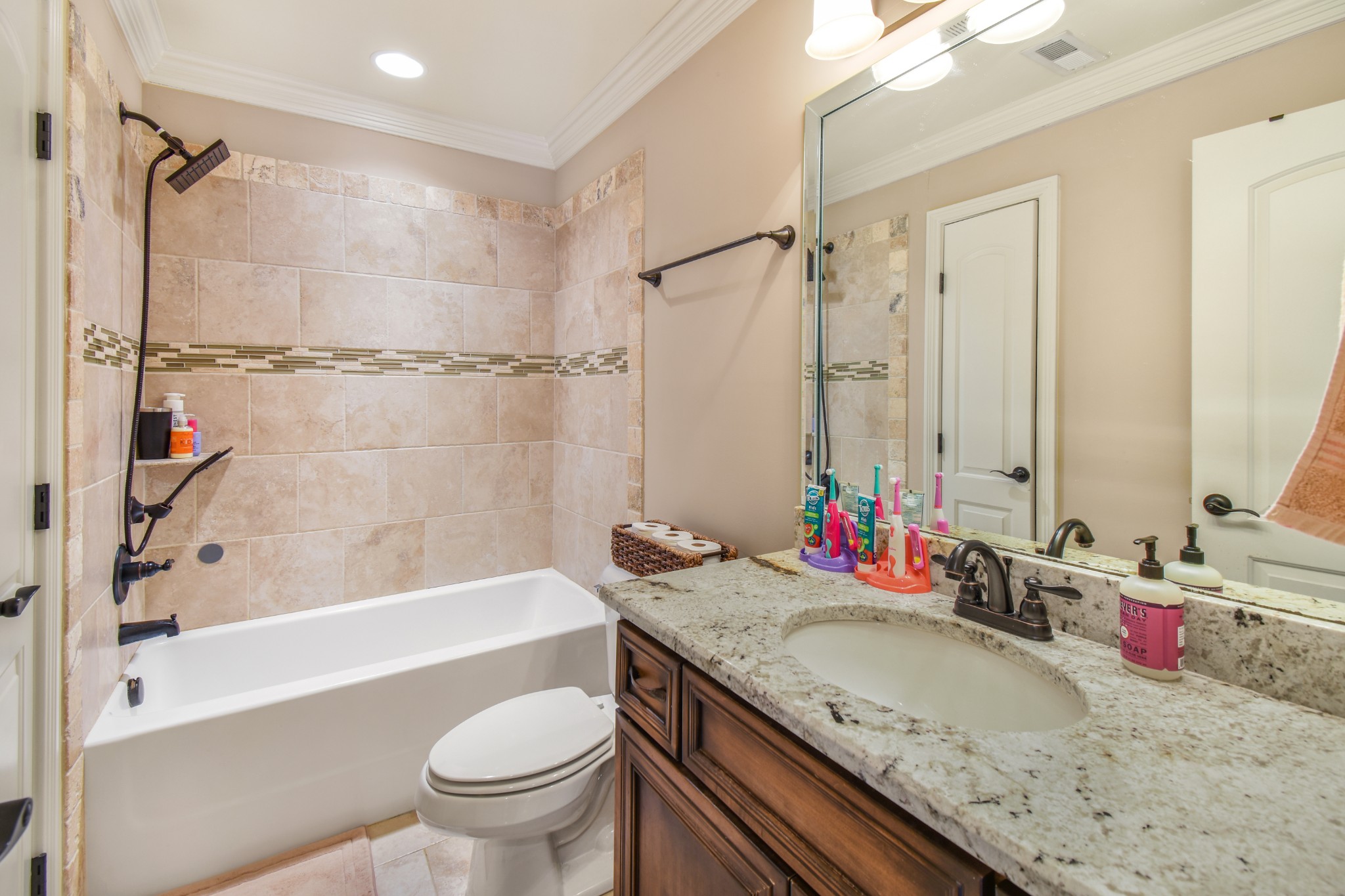 1133 Mires Road Mount Juliet, TN 37122 - Photo 28 of 51 a bathroom with a granite countertop sink a toilet and shower