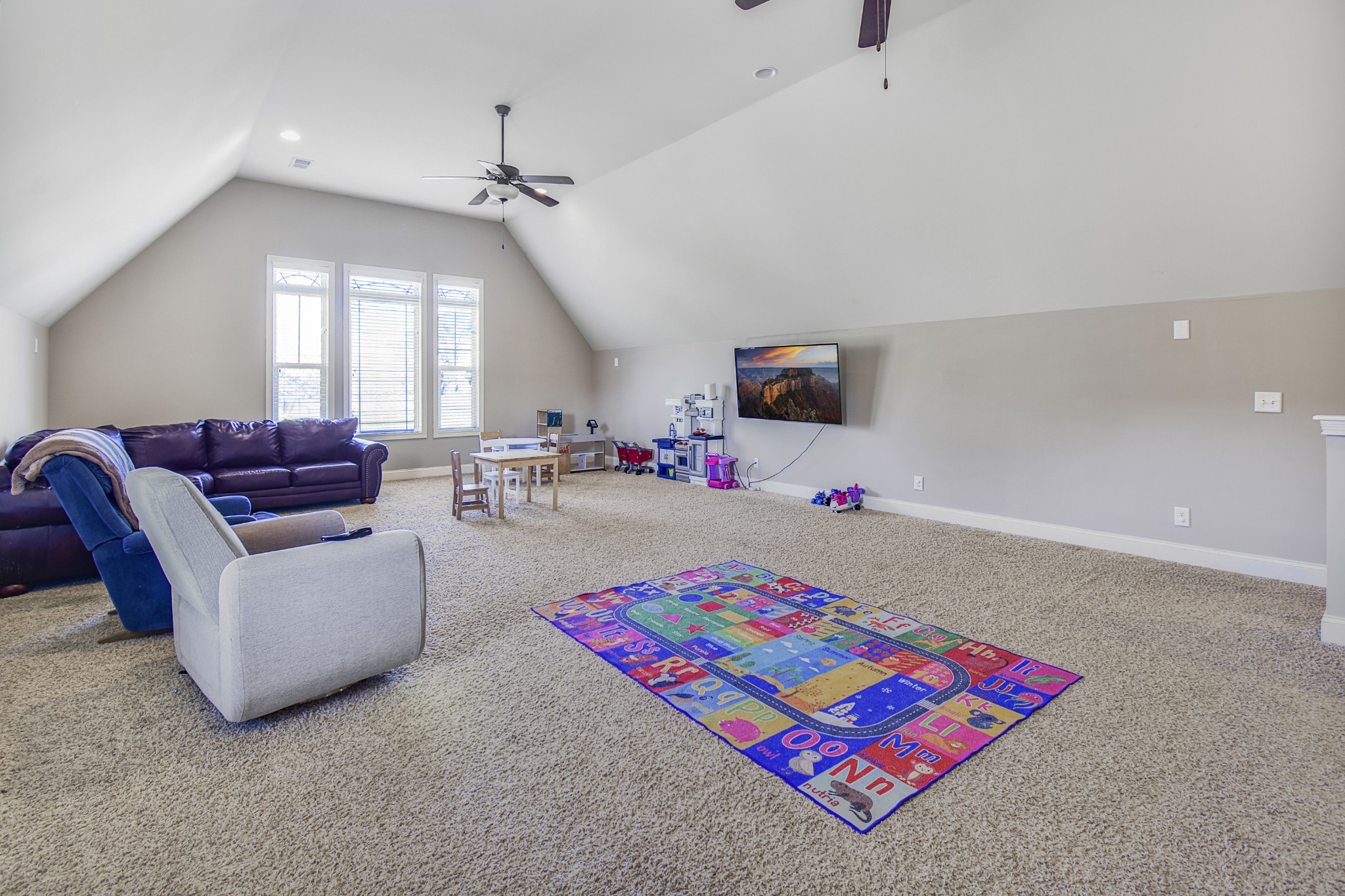 1133 Mires Road Mount Juliet, TN 37122 - Photo 29 of 51 a living room with furniture and a flat screen tv