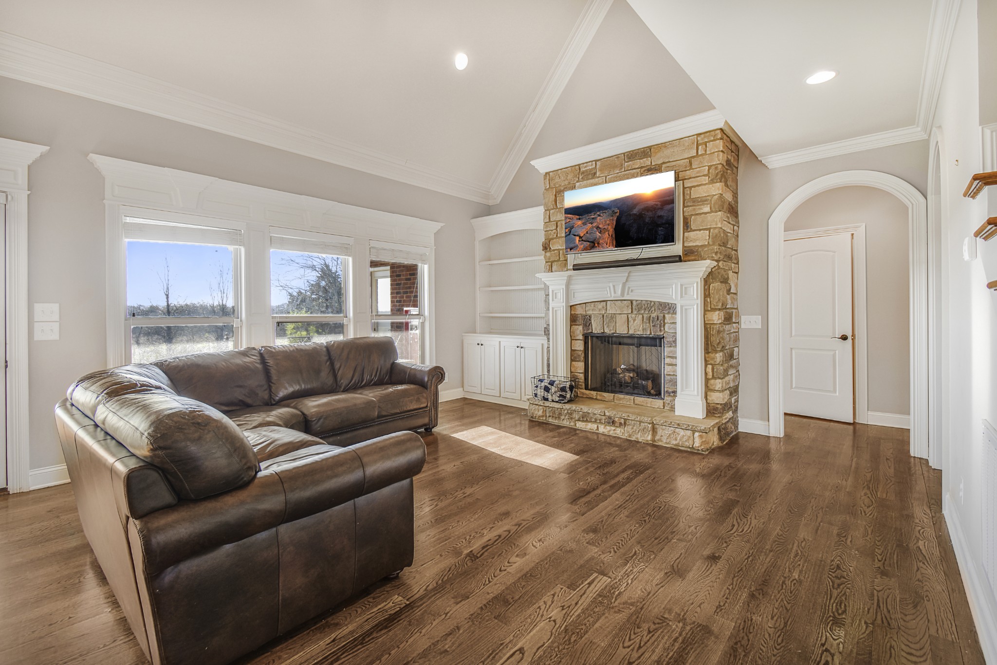 1133 Mires Road Mount Juliet, TN 37122 - Photo 7 of 51 a living room with furniture a flat screen tv and a fireplace