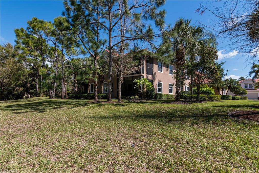 7837 Hawthorne Drive, Unit 1101 Naples, FL 34113 - Photo 21 of 26 a view of a park with large trees