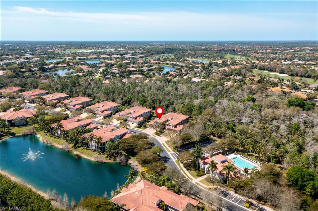 7837 Hawthorne Drive, Unit 1101 Naples, FL 34113 - Photo 22 of 26 an aerial view of residential houses with outdoor space