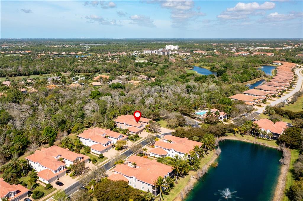 7837 Hawthorne Drive, Unit 1101 Naples, FL 34113 - Photo 24 of 26 an aerial view of residential houses with outdoor space