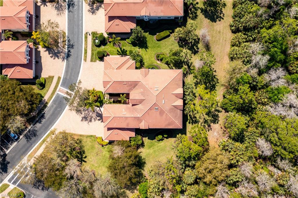 7837 Hawthorne Drive, Unit 1101 Naples, FL 34113 - Photo 25 of 26 an aerial view of a house with a yard and garden