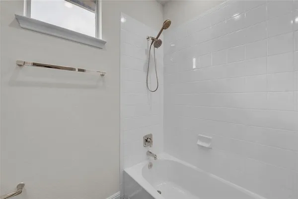 a bathroom with a white bath tub