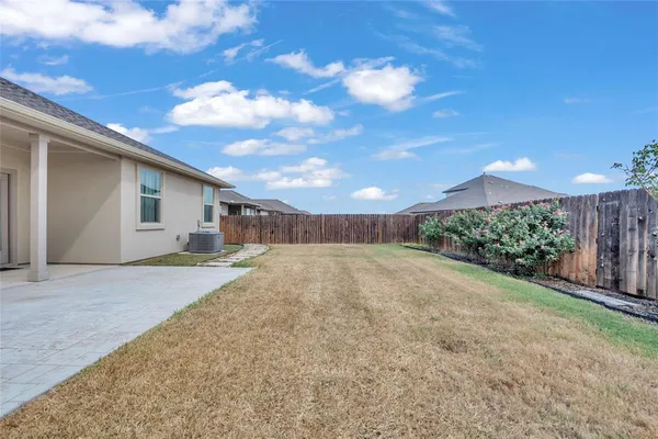 a view of a backyard of a house