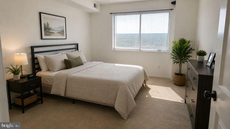 1836 Metzerott Road, Unit 1720 Hyattsville, MD 20783 - Photo 12 of 35 a bedroom with a bed potted plant with the window