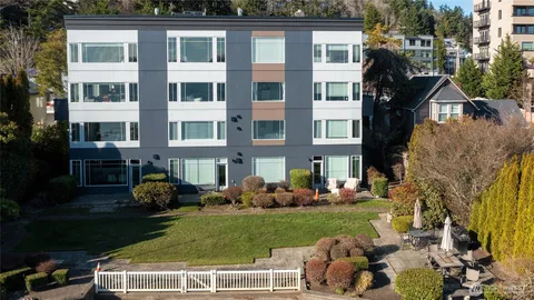 a front view of a house with a garden and porch