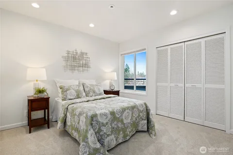 a bathroom with a granite countertop sink a toilet and a bathtub