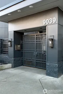 a view of staircase with wooden floor and fan