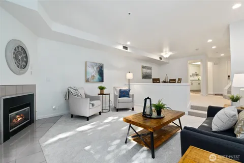 a view of a dining room with furniture and a large window