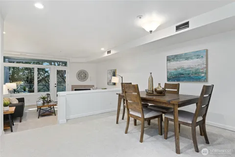 a kitchen with cabinets stainless steel appliances and a sink