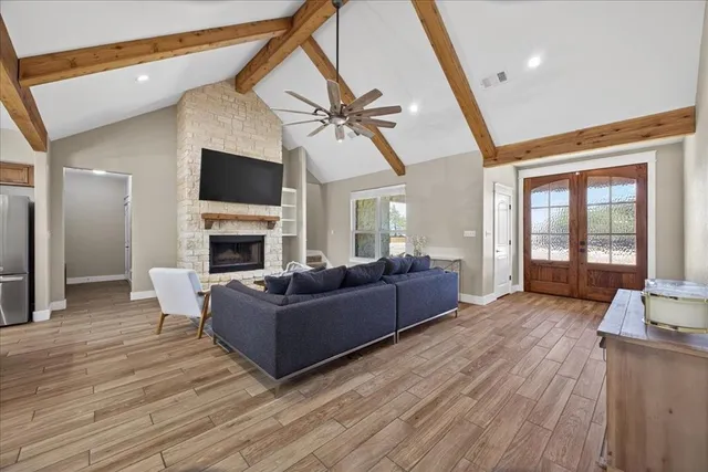 a living room with furniture and a fireplace