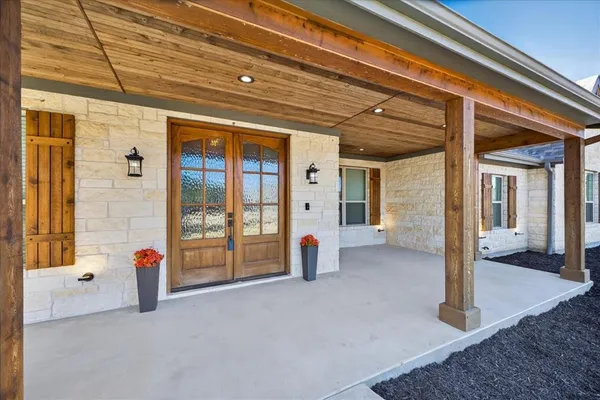 a view of a porch with seating space