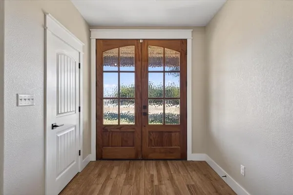 a view of entryway with wooden floor