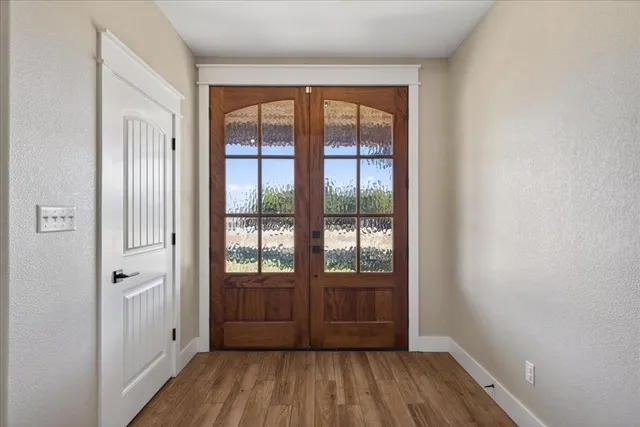 a view of entryway with wooden floor